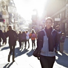 Urban Girl Striding Through City Area