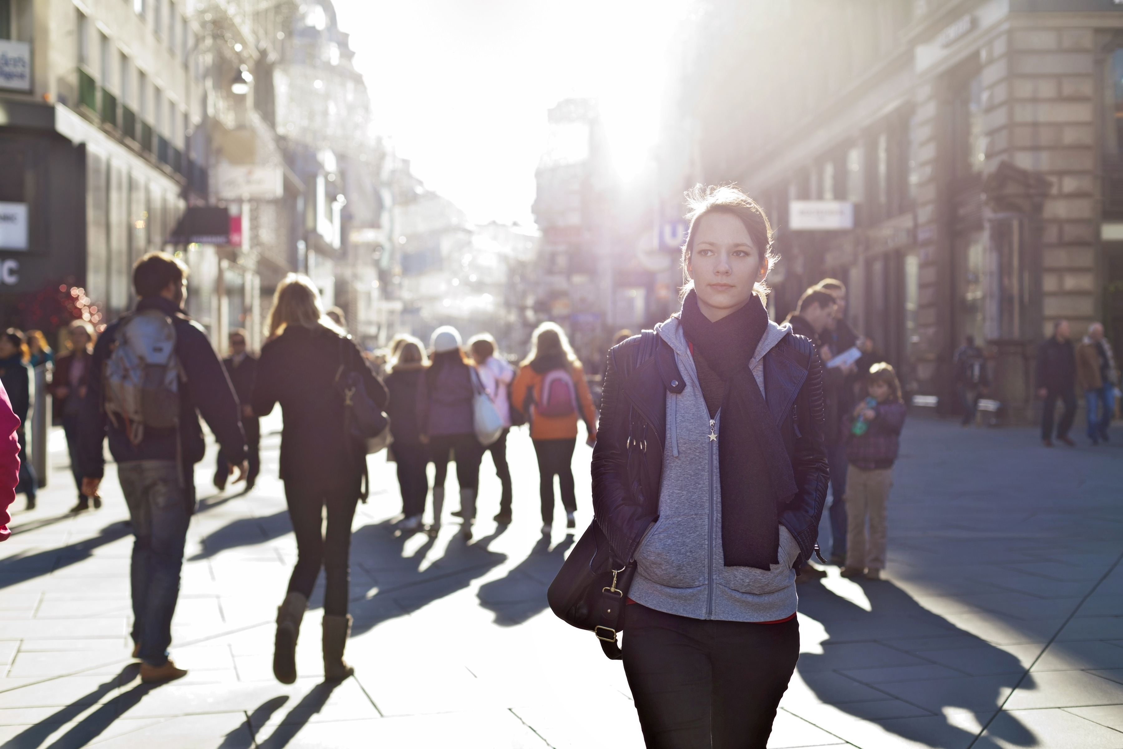 Urban Girl Striding Through City Area